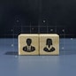 Two wooden blocks with man and woman icon on dark background. Concept of gender equality.