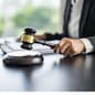 Lawyer businessman working with lawbook in office or courtroom Legal counsel with gavel and legal law. justice and lawyer concept Judge gavel hammer on Lawyer desk