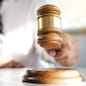 justice lawyer in a office , selected focus on hammer.