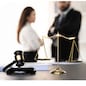 Balanced scale of justice and gavel hammer in focus on blurred background of lawyer colleagues discuss and plan for lawsuit in law firm office, as legal representatives. Equilibrium