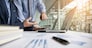 Business adviser analyzing financial figures denoting the progress in the work of the company.