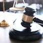 Judge gavel hammer with smartphone on Lawyer desk
