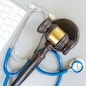law gavel, stethoscope and face anti virus masks, medical law concept, copy space