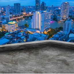 blank roof top of building with skyscraper landscape background