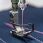 Professional sewing machine close-up. Modern textile industry.