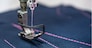 Professional sewing machine close-up. Modern textile industry.