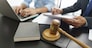 Lawyer and legal concept, Businessman typing on laptop as senior lawyer explain detail of contract.