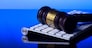 Wooden law gawel on computer keyboard, internet auction concept