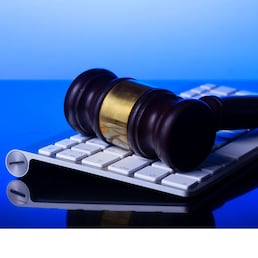 Wooden law gawel on computer keyboard, internet auction concept