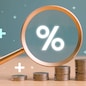 Interest rate rise, dividend money investment concept. Business provision of financial service. Gold magnifying glass finding on house loan interest rate percentage icon, mortgage rate blue background