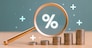 Interest rate rise, dividend money investment concept. Business provision of financial service. Gold magnifying glass finding on house loan interest rate percentage icon, mortgage rate blue background