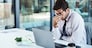 Stress, headache and man on laptop in office frustrated with glitch, mistake or crisis. Anxiety, migraine and male business person angry with failure, 404 or bad review, deadline report or tech delay.