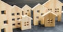 City of wooden figurines of houses. Buying and selling real estate. Renovation and home improvement. Mortgage loan. Building maintenance. Renting housing, realtor services.