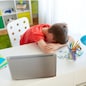 education, cyberbullying and people concept - tired or sad student boy with laptop computer lying on desk at home suffering from bullying