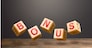Hover blocks with letters make word BONUS. Receive rewards and preferences. Salary increase, wage premium for holidays. Rising at work. A nice addition. Favorable purchase and special promotions.