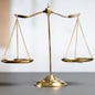 Shiny golden balanced scale in court library background as concept justice and fairness legal symbol. Scale balance for righteous and equality judgment by lawyer and attorney. equility