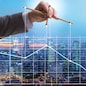 The businessman controlling the market with strings