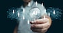 AI technology for HR, Human resources. A man holds lightbulb with artificial intelligence chip in it representing using Ai and automation to manage and recruit employees. Automate the hiring process