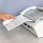 hand man are using a fax machine in the office Business concept