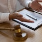 Lawyer present client with contract papers on the table in office. consultant lawyer, attorney, court judge, concept.
