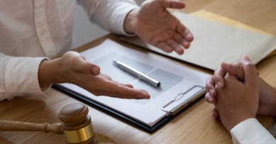 Lawyer present client with contract papers on the table in office. consultant lawyer, attorney, court judge, concept.