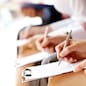 Businesspeople hands over papers making notes at seminar