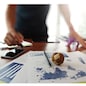 Moving Image of Business creative designer working wooden texture globe with smart phone on business document in office desk as internet concept