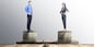 Asian businessman and businesswoman standing on coins stack with same height on balancer. Equality gender concept