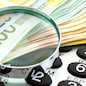 Euro Notes with calculator and magnifier. Closeup