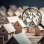 Searching new house for purchase. Rental housing market. Magnifying glass near residential building. Created with Generative AI