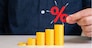 Growing stack of coins and percentage symbol. Capital growth and increase of savings on deposit and investments. Financial planning, return on investment, and interest compounding.