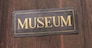 Entrance of an ancient museum, letters on original marble
