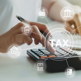 women using calculator calculated individual income tax for pay taxes annual.Financial research,government taxes and calculation tax return concept. Tax and Vat concept.