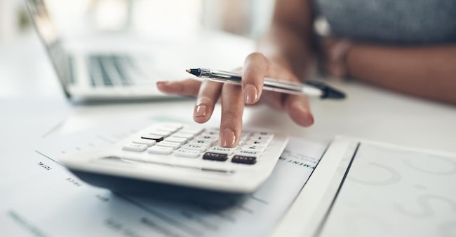 Finance planning, budget or savings manager calculating expenses, taxes or company profits with laptop, paperwork or calculator. Closeup hands of female financial leader checking office staff payroll.