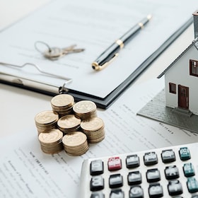 House model with real estate agent and customer discussing for contract to buy house, insurance or loan real estate background.