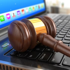 Online internet auction. Gavel on laptop.  3d