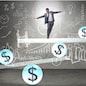 Businessman balancing in financial dollar concept