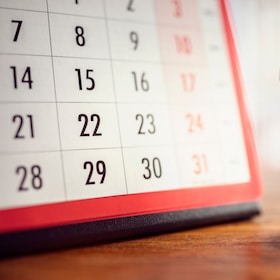 Hour glass and calendar concept for time slipping away for important appointment date, schedule and deadline