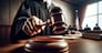 A judge's hand is poised to administer justice with a gavel in a courtroom, symbolizing the weight of judicial decisions