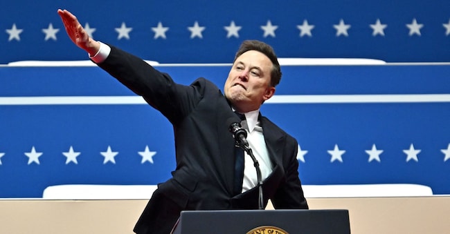 AFP PICTURES OF THE YEAR 2025 Tesla and SpaceX CEO Elon Musk gestures as he speaks during the inaugural parade inside Capitol One Arena, in Washington, DC, on January 20, 2025. (Photo by ANGELA WEISS / AFP) / AFP PICTURES OF THE YEAR 2025