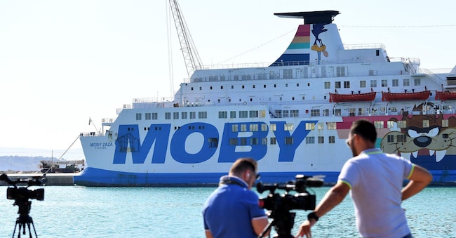 The Moby Zazà ferry, with migrants on board who have quarantined and are waiting to disembark, awaiting the transfer of 180 migrants from the SOS Mediterranee humanitarian vessel Ocean Viking. Porto Empedocle (Agrigento), Sicily Island, 6 July 2020. ANSA / CARMELO IMBESI