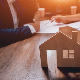 Man sign a home insurance policy on home loans. Estate agent with customer before contract signature. Real Estate concept. Insurance agency concept