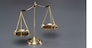 Shiny golden balanced scale in courtroom background as concept justice and a common legal symbol. Scale balance for righteous and equality judgment by lawyer and attorney. Equilibrium