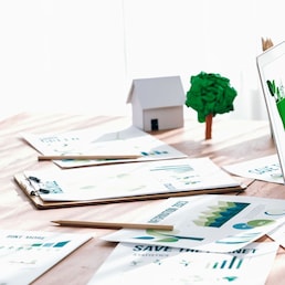 Businessman in green corporate company planning eco-friendly and environmental conservative to reduce CO2 and implement net zero policy in meeting room with eco idea on laptop screen. Trailblazing