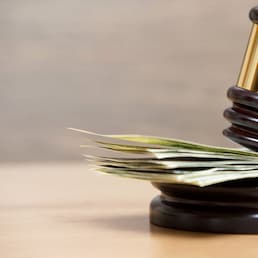 Law gavel on a stack of American money