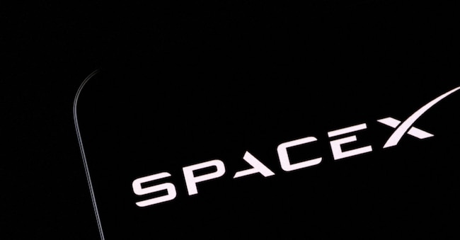 FILE PHOTO: SpaceX logo and Elon Musk silhouette are seen in this illustration taken, December 19, 2022. REUTERS/Dado Ruvic/Illustration/File Photo