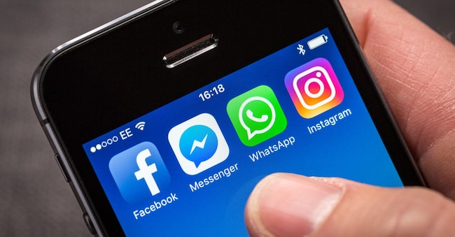 M9MRYW Facebook and associated social media company apps, Facebook Messenger, WhatsApp and Instagram on an iPhone
