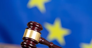Judge hammer with European flag background