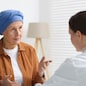 Senior woman with cancer visiting oncologist in clinic