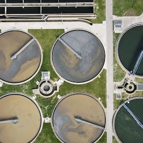 Aerial top view of round polls in wastewater treatment plant, filtration of dirty or sewage water. High quality photo